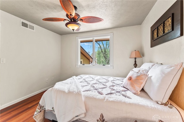 255 Belle Watlin Ct, Dayton, OH 45434 - bedroom featuring wood finished floors, a ceiling fan, and a textured ceiling