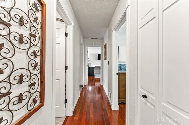 255 Belle Watlin Ct, Dayton, OH 45434 - hallway with wood finished floors and a textured ceiling