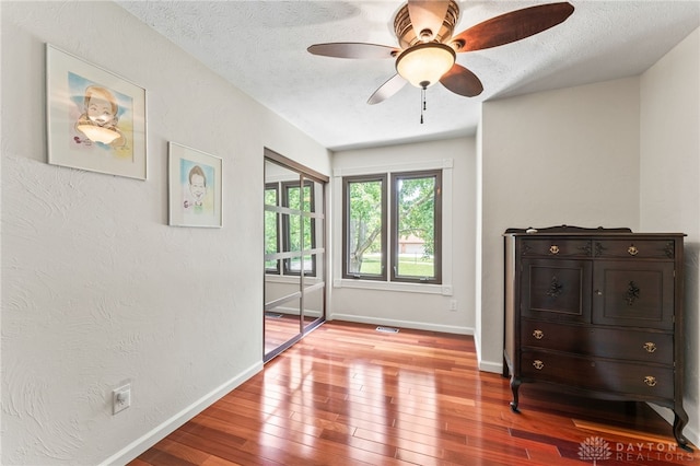 255 Belle Watlin Ct, Dayton, OH 45434 - bedroom with hardwood / wood-style floors, a textured ceiling, and a ceiling fan