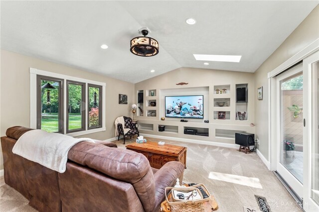 255 Belle Watlin Ct, Dayton, OH 45434 - living room featuring vaulted ceiling, built in features, healthy amount of natural light, a skylight, and light carpet
