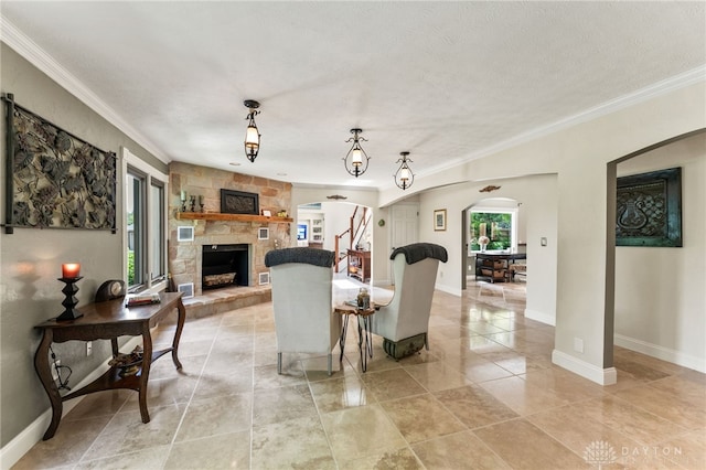 255 Belle Watlin Ct, Dayton, OH 45434 - living area featuring a stone fireplace, arched walkways, ornamental molding, and light tile patterned floors