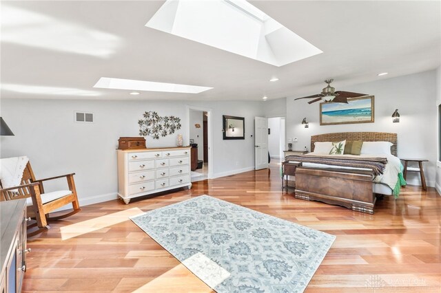 255 Belle Watlin Ct, Dayton, OH 45434 - bedroom featuring a skylight, light wood-style flooring, and recessed lighting