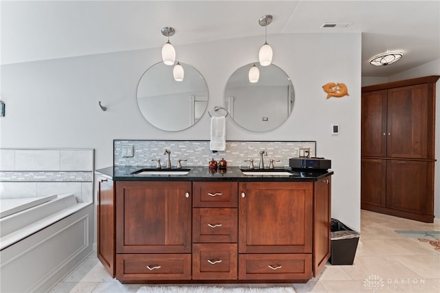 255 Belle Watlin Ct, Dayton, OH 45434 - full bathroom with double vanity, decorative backsplash, a garden tub, and tile patterned floors