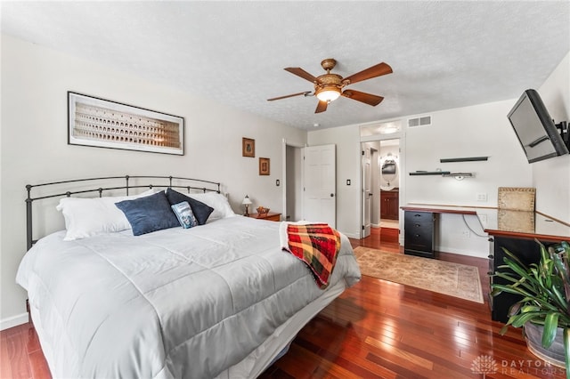 255 Belle Watlin Ct, Dayton, OH 45434 - bedroom featuring hardwood / wood-style floors, ceiling fan, a textured ceiling, and connected bathroom