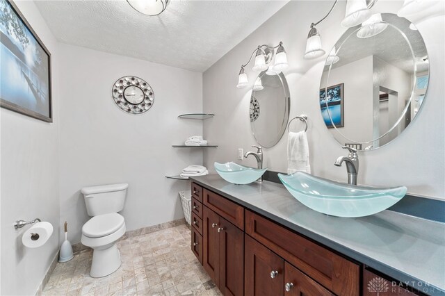 255 Belle Watlin Ct, Dayton, OH 45434 - bathroom with a textured ceiling and double vanity