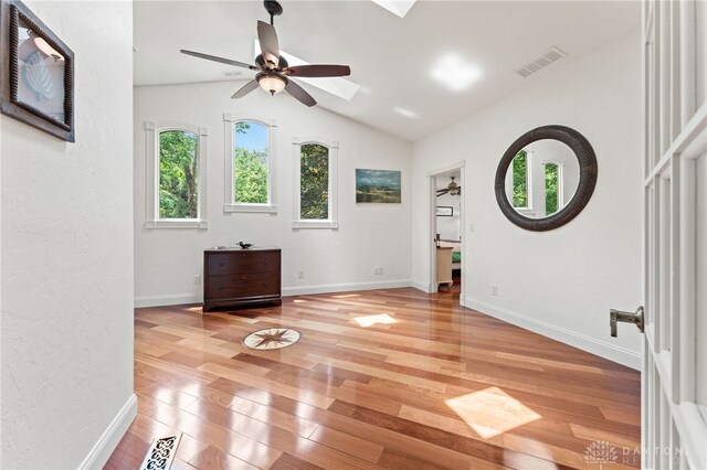 255 Belle Watlin Ct, Dayton, OH 45434 - spare room with light wood-style floors, ceiling fan, lofted ceiling, and a skylight