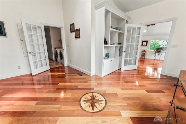 255 Belle Watlin Ct, Dayton, OH 45434 - corridor with french doors, washer and dryer, light wood-type flooring, and lofted ceiling