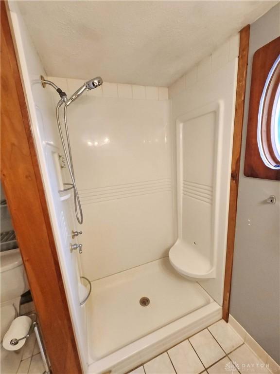 3054 Carpenter Rd, Jefferson Twp, OH 45335 - full bathroom featuring tile patterned floors and a shower stall