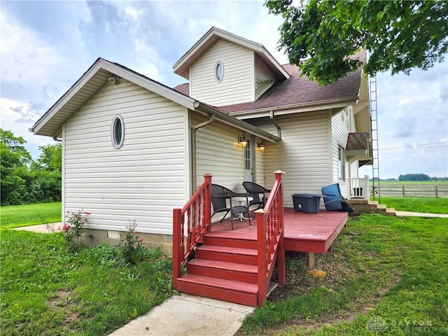 3054 Carpenter Rd, Jefferson Twp, OH 45335 - rear view of house with a lawn, a deck, and roof with shingles