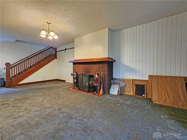 3054 Carpenter Rd, Jefferson Twp, OH 45335 - unfurnished living room with a chandelier, carpet, a fireplace, stairs, and a textured ceiling