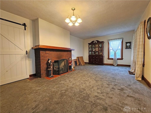 3054 Carpenter Rd, Jefferson Twp, OH 45335 - unfurnished living room with carpet floors, a fireplace, a chandelier, a textured ceiling, and a barn door
