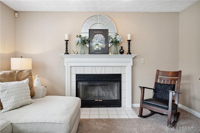 25 Huntley Ct, Springboro, OH 45066 - carpeted bedroom featuring a tiled fireplace and tile patterned floors