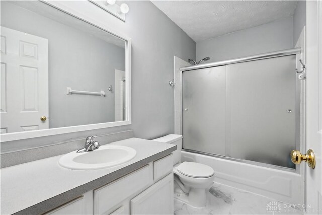 25 Huntley Ct, Springboro, OH 45066 - full bath featuring marble look tile flooring, vanity, enclosed tub / shower combo, and a textured ceiling