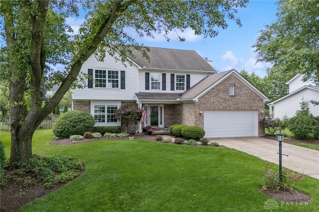 25 Huntley Ct, Springboro, OH 45066 - traditional-style house featuring concrete driveway, brick siding, an attached garage, and a shingled roof
