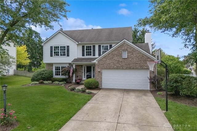 25 Huntley Ct, Springboro, OH 45066 - traditional home with brick siding, driveway, a chimney, and a garage