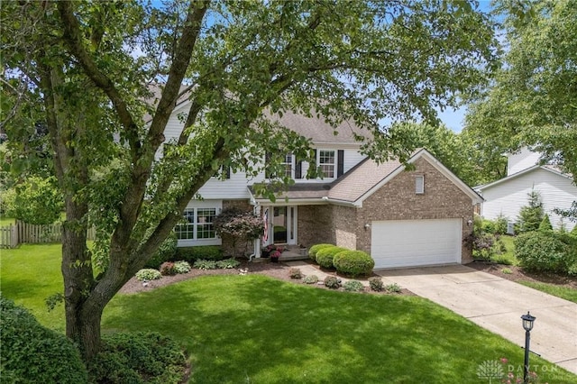 25 Huntley Ct, Springboro, OH 45066 - view of front of property featuring brick siding, concrete driveway, an attached garage, and a shingled roof