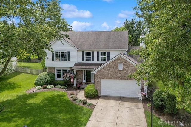 25 Huntley Ct, Springboro, OH 45066 - traditional-style home with concrete driveway, an attached garage, brick siding, and a shingled roof