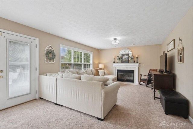 25 Huntley Ct, Springboro, OH 45066 - living area with light carpet, a fireplace, and a textured ceiling