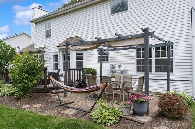 25 Huntley Ct, Springboro, OH 45066 - back of house with a pergola, a chimney, and a wooden deck