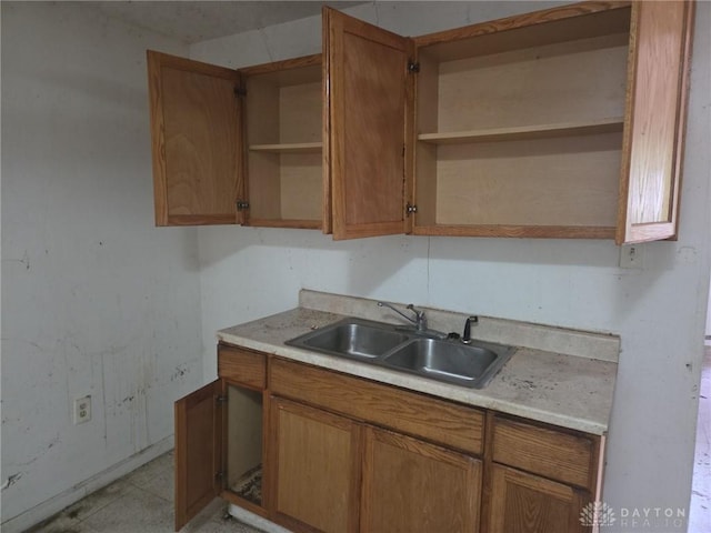 800 Linden Ave, Dayton, OH 45410 - kitchen with open shelves, light countertops, and brown cabinetry