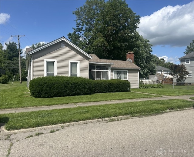 373 Walnut St, Xenia, OH 45385 - view of front of house featuring a chimney and a front yard