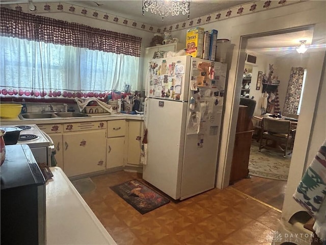 373 Walnut St, Xenia, OH 45385 - kitchen featuring white appliances, light countertops, and white cabinets