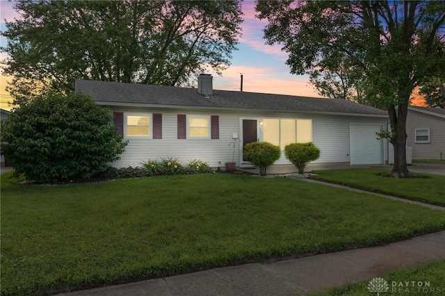 242 Poe Ln, Xenia, OH 45385 - single story home with an attached garage, a front lawn, and a chimney