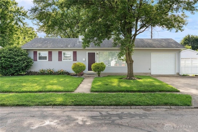 242 Poe Ln, Xenia, OH 45385 - single story home featuring driveway, a garage, a front lawn, a shingled roof, and entry steps