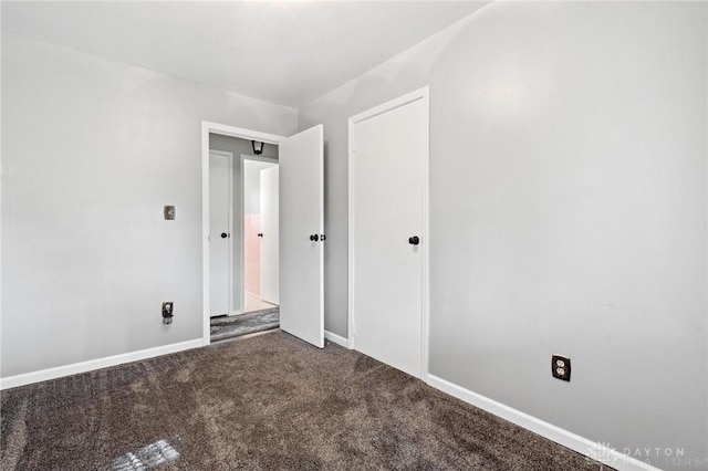 242 Poe Ln, Xenia, OH 45385 - unfurnished bedroom with carpet and a closet
