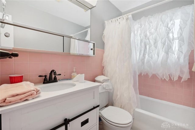 242 Poe Ln, Xenia, OH 45385 - full bathroom featuring tile walls, vanity, and shower / bath combination with curtain