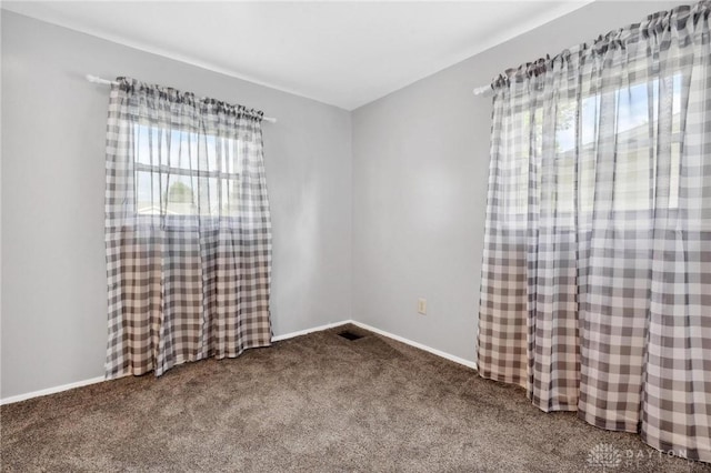 242 Poe Ln, Xenia, OH 45385 - unfurnished room with dark carpet and baseboards