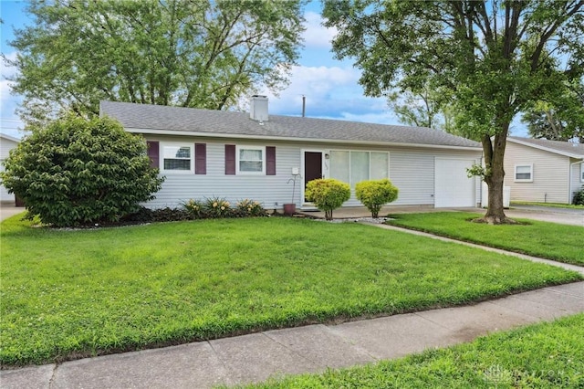 242 Poe Ln, Xenia, OH 45385 - ranch-style house featuring an attached garage, concrete driveway, a front lawn, and a chimney