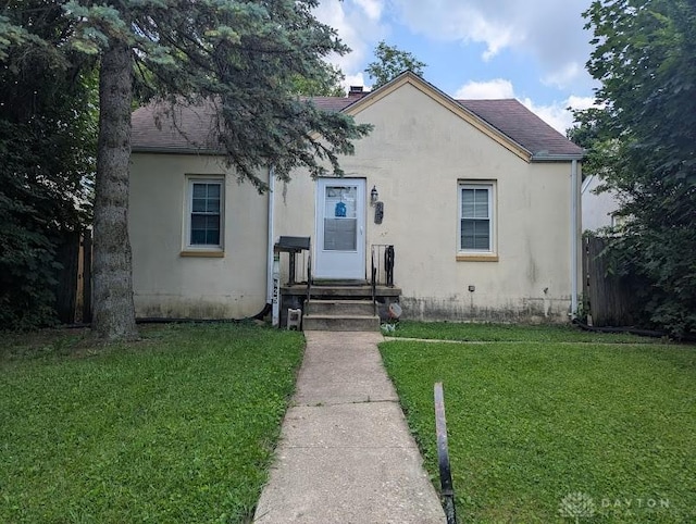 825 E Rose St, Springfield, OH 45505 - bungalow featuring stucco siding and roof with shingles