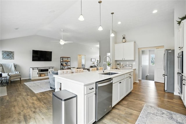 3109 Running Deer Trl, Franklin Twp, OH 45005 - kitchen with stainless steel appliances, a ceiling fan, open floor plan, vaulted ceiling, and a center island with sink