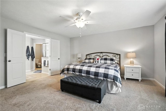 3109 Running Deer Trl, Franklin Twp, OH 45005 - carpeted bedroom with ensuite bathroom and ceiling fan
