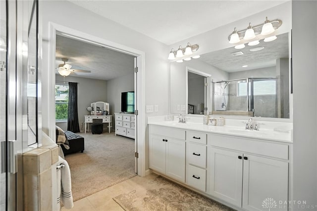 3109 Running Deer Trl, Franklin Twp, OH 45005 - ensuite bathroom with double vanity, a stall shower, tile patterned flooring, and a ceiling fan