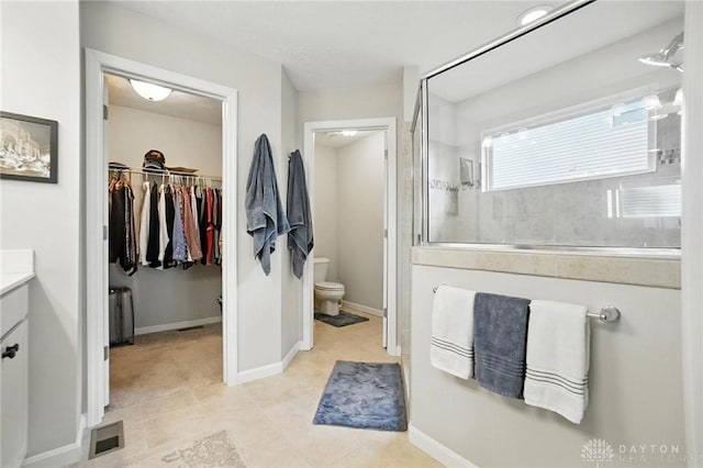 3109 Running Deer Trl, Franklin Twp, OH 45005 - bathroom featuring vanity, a tile shower, and a spacious closet