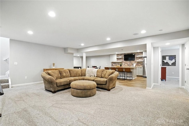 3109 Running Deer Trl, Franklin Twp, OH 45005 - living area with recessed lighting, stairs, light carpet, and bar