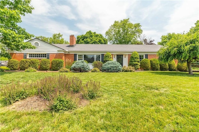 187 Cheltenham Dr, Washington Twp, OH 45459 - ranch-style home with a chimney, a front yard, and brick siding