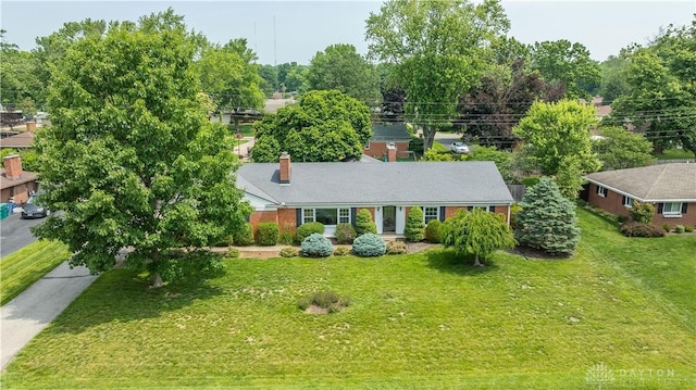 187 Cheltenham Dr, Washington Twp, OH 45459 - view of front of home with a chimney and a front lawn