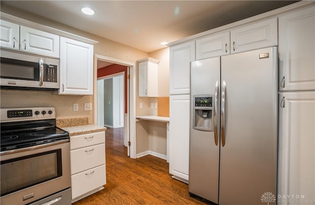 187 Cheltenham Dr, Washington Twp, OH 45459 - kitchen featuring appliances with stainless steel finishes, wood finished floors, light countertops, white cabinetry, and recessed lighting