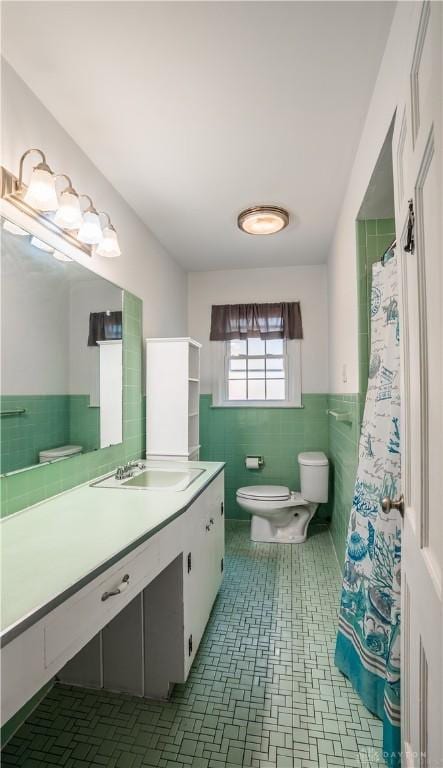 187 Cheltenham Dr, Washington Twp, OH 45459 - bathroom featuring tile walls, vanity, and wainscoting