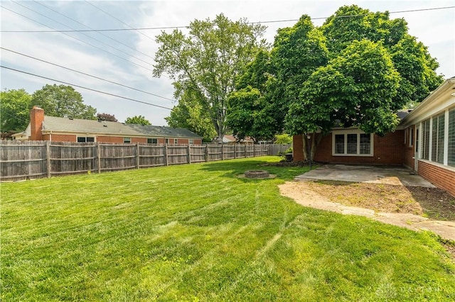 187 Cheltenham Dr, Washington Twp, OH 45459 - fenced backyard with a patio area and an outdoor fire pit