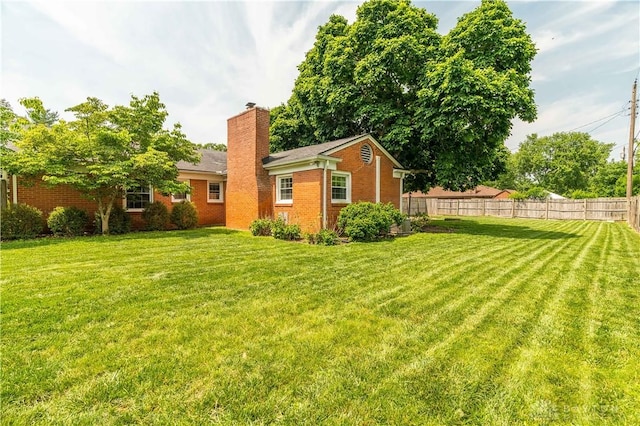 187 Cheltenham Dr, Washington Twp, OH 45459 - rear view of property with a chimney and brick siding