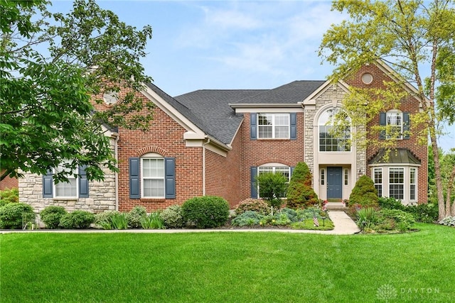 9764 Olde Georgetown Way, Dayton, OH 45458 - view of front facade featuring a front lawn, stone siding, brick siding, and a shingled roof