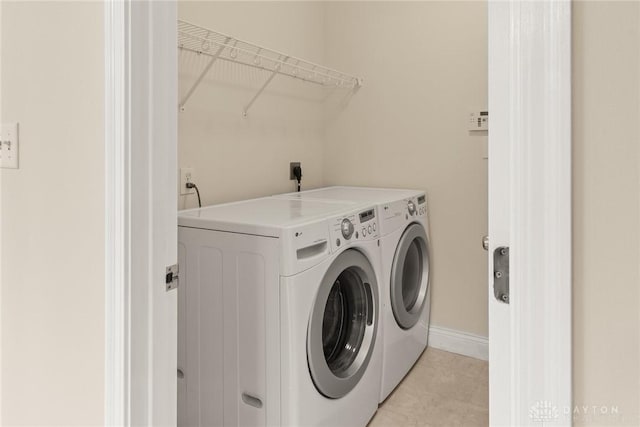 9764 Olde Georgetown Way, Dayton, OH 45458 - washroom with independent washer and dryer and light tile patterned floors