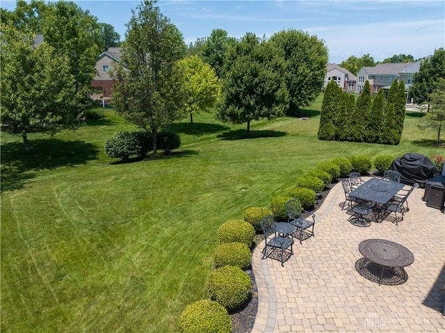 9764 Olde Georgetown Way, Dayton, OH 45458 - view of green lawn with a patio and outdoor dining area