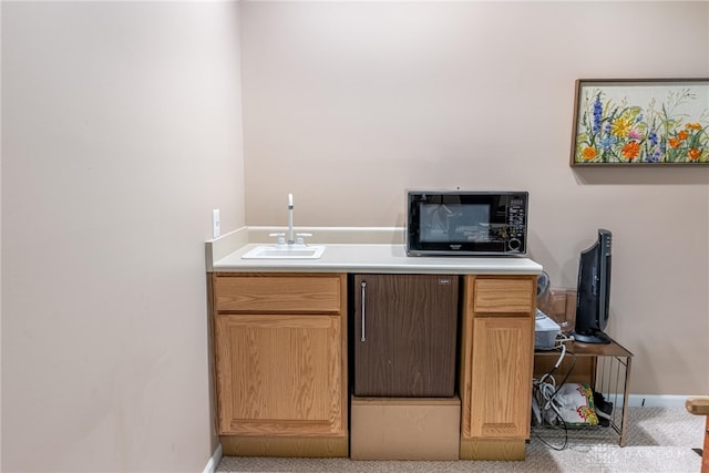 866 Deer Run Rd, Centerville, OH 45459 - kitchen featuring black microwave, light countertops, and light colored carpet