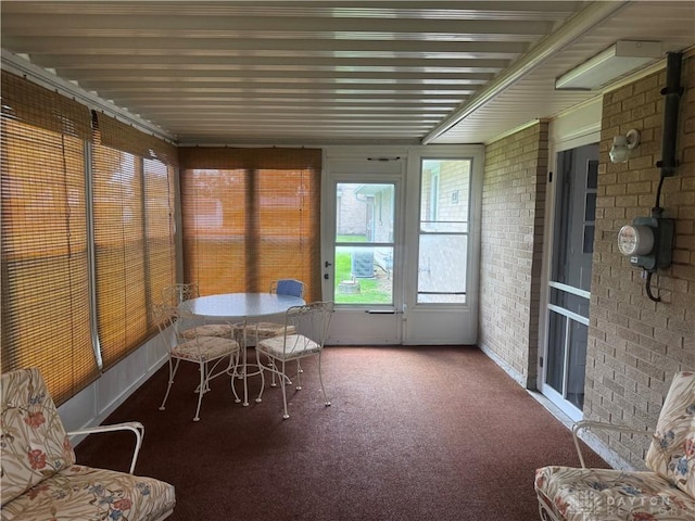 435 Nies Ave, Englewood, OH 45322 - sunroom with brick wall and carpet floors