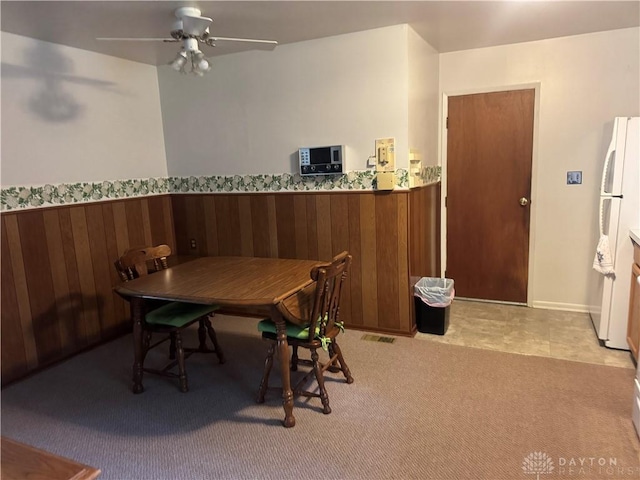435 Nies Ave, Englewood, OH 45322 - dining room with ceiling fan and wooden walls